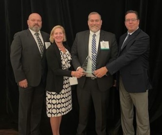 (Left to right) PdM BEC ABIS IT Specialist Jimmie Culley, DFSC BOD Deputy Assistant Director Amy Turlock, PdM BEC Forrest Church, and Leidos DoD ABIS PM David Jones accepted the award on behalf of the DoD ABIS BDMF team. (Courtesy photo)