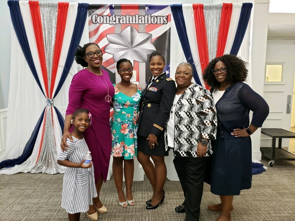 Lt. Col. Courtney Gary, Product Manager for Data and Analytics (center), with her mother (right) and family (Photo Credit: U.S. Army)
