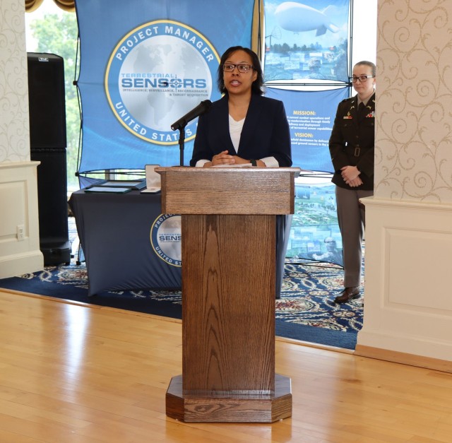 Lareina Adams, Project Manager for Terrestrial Sensors (PM TS), addresses the PM TS organization during a recent change of charter ceremony. (Photo Credit: Brian Cooper)