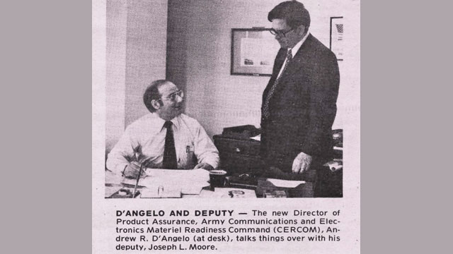 The new Director of Product Assurance, Army Communications and Electronics Materiel Readiness Command (CERCOM), Andrew R. D'Angelo (at desk), talks things over with his deputy, Joseph L. Moore. (Courtesy photo)