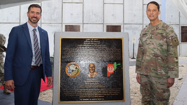 Mark Kitz, then-Program Executive Officer Intelligence, Electronic Warfare & Sensors, and Lt. Gen. (Ret) Robert Marion, then Principal Military Deputy ASA(ALT), with the Maj. Gen. Harold Greene plaque at the Myer Auditorium at Aberdeen Proving Ground, Maryland. (Photo Credit: Courtesy photo)