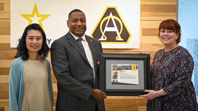 Dr. Eric Moore, deputy to the commanding general of U.S. Army Combat Capabilities Development Command, center, receives a Certificate of Recognition award from Program Executive Office Intelligence, Electronic Warfare & Sensors Human Capital Strategist Cheryl Litteral, right, and Valerie DeVries, human capital director for PEO Simulation, Training and Instrumentation. Dr. Moore spoke at a Human Resources Forum about the different internship program