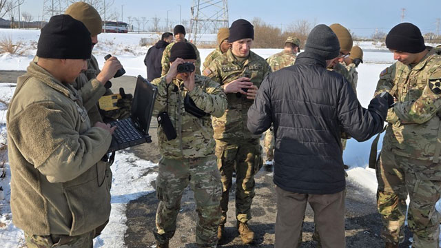 Instrument Set, Reconnaissance and Surveying (ENFIRE) trainees use laser finder to measure bridge length. (Photo Credit: Fred Knudsen )