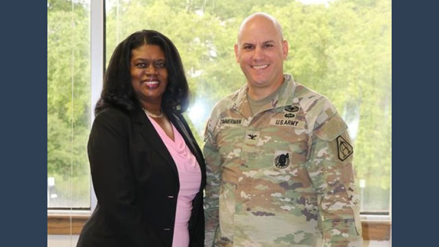 Colonel Brock Zimmerman, Project Manager Aircraft Survivability Equipment (PM ASE) (r) and Kassel Kendricks, Management Analyst PM ASE, express their appreciation for the overwhelming generosity of the organization. (Photo Credit: Sherri Dorner)