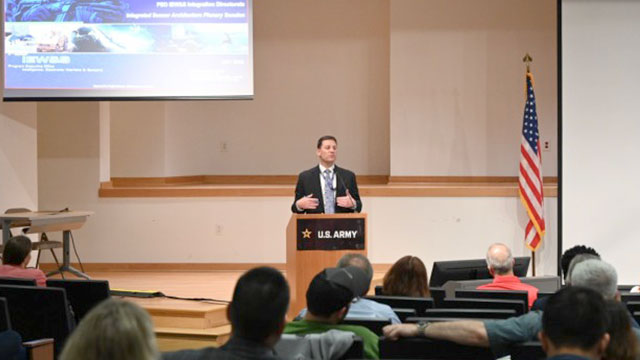 (Acting) Deputy Program Executive Officer Kyle Perkins provided opening remarks during the ISA Community Summit. (Photo Credit: PEO IEW&S)