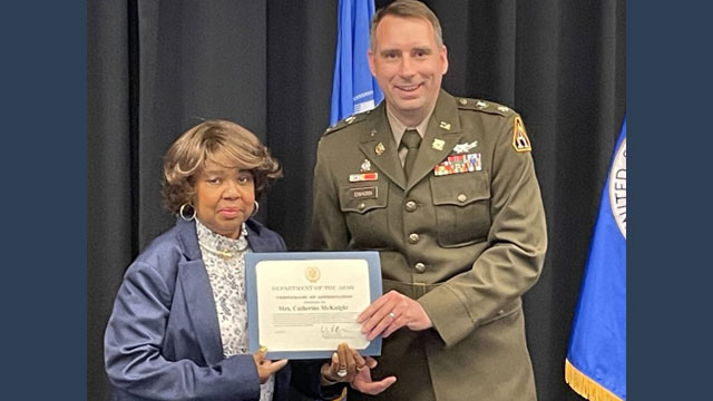 Catherine McKnight receives a Department of the Army Certificate of Appreciation from Product Manager Force Protection Systems Lt. Col. Matthew T. Einhorn.