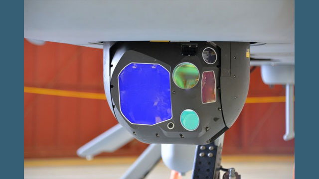 The Common Sensor Payload is the electro-optical/infrared/laser range designator sensor for battlefield commanders onboard the MQ-1C Gray Eagle uncrewed aircraft system. It provides real-time imagery for detection and classification of targets and threats for battlefield commanders with day and night imaging sensors, laser designation, pointing, target marking, and spot tracking for aerial intelligence. (Photo Credit: U.S. Army Photo)