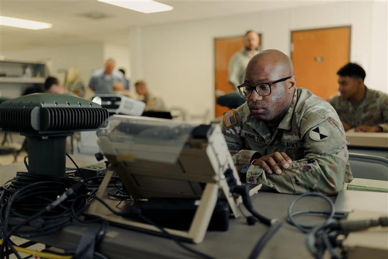 Soldiers participate in New Equipment Training for MAPS GEN II. The system consists of an in-vehicle component and an anti-jam, anti-spoof exterior antenna. (Photo by PEO IEW&S)